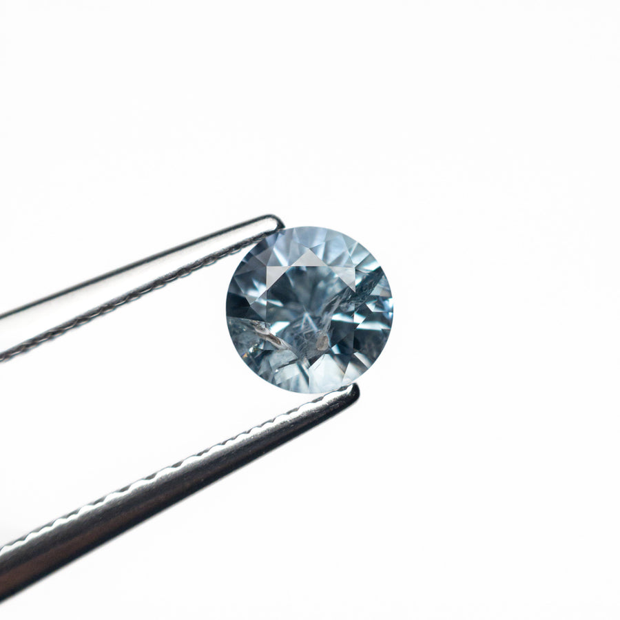 The 0.61ct 5.12x5.10x3.37mm Round Brilliant Sapphire 26556-20 by East London jeweller Rachel Boston | Discover our collections of unique and timeless engagement rings, wedding rings, and modern fine jewellery. - Rachel Boston Jewellery