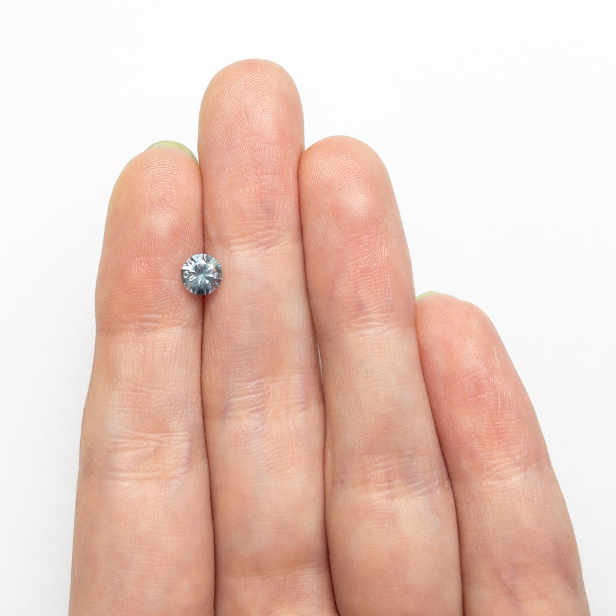 The 0.61ct 5.12x5.10x3.37mm Round Brilliant Sapphire 26556-20 by East London jeweller Rachel Boston | Discover our collections of unique and timeless engagement rings, wedding rings, and modern fine jewellery. - Rachel Boston Jewellery