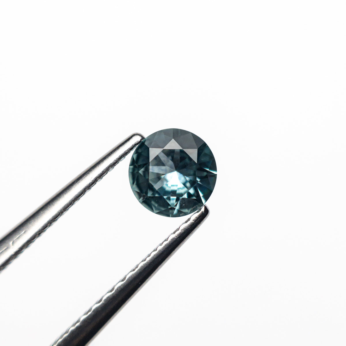 The 0.44ct 4.83x4.78x2.52mm Round Brilliant Sapphire 26556-22 by East London jeweller Rachel Boston | Discover our collections of unique and timeless engagement rings, wedding rings, and modern fine jewellery.