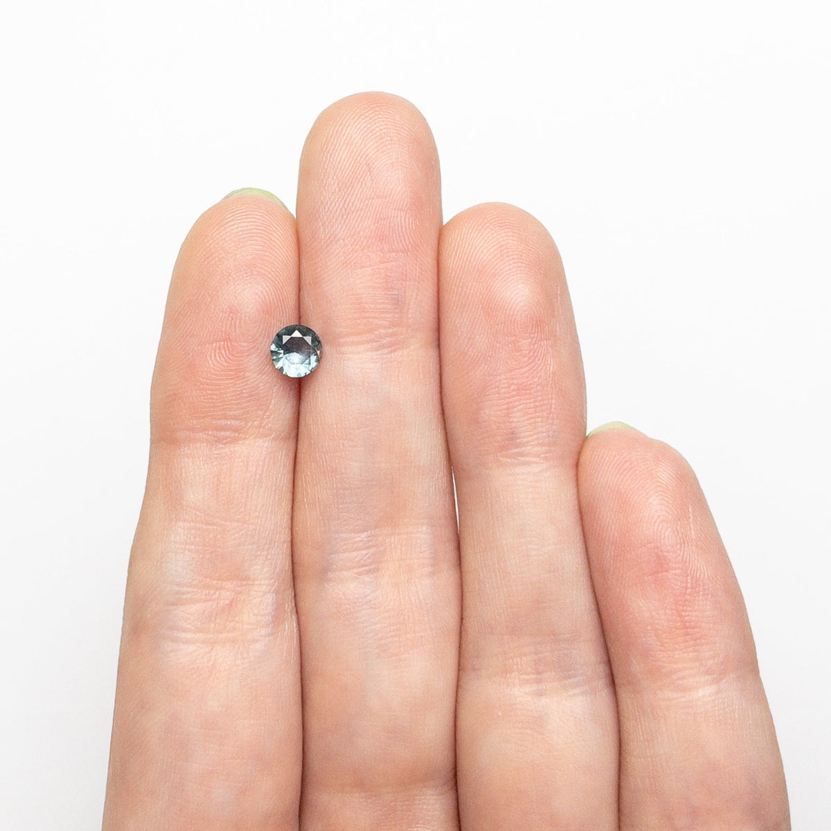 The 0.44ct 4.83x4.78x2.52mm Round Brilliant Sapphire 26556-22 by East London jeweller Rachel Boston | Discover our collections of unique and timeless engagement rings, wedding rings, and modern fine jewellery.