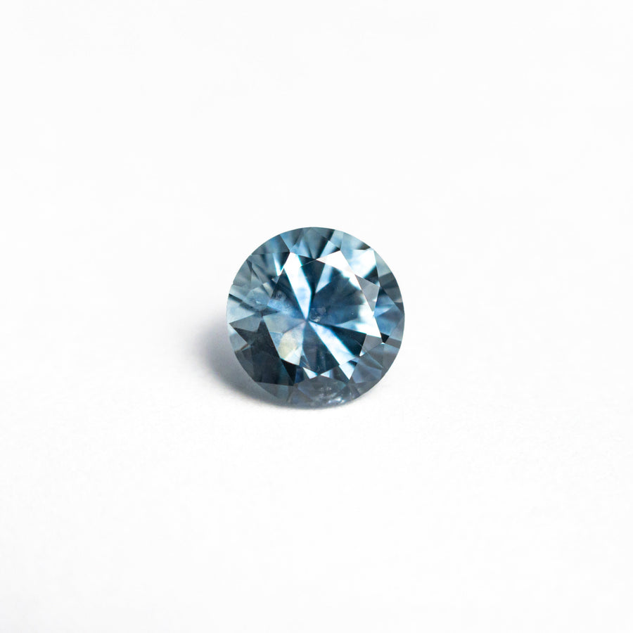 The 0.70ct 5.29x5.27x3.60mm Round Brilliant Sapphire 26556-23 by East London jeweller Rachel Boston | Discover our collections of unique and timeless engagement rings, wedding rings, and modern fine jewellery. - Rachel Boston Jewellery
