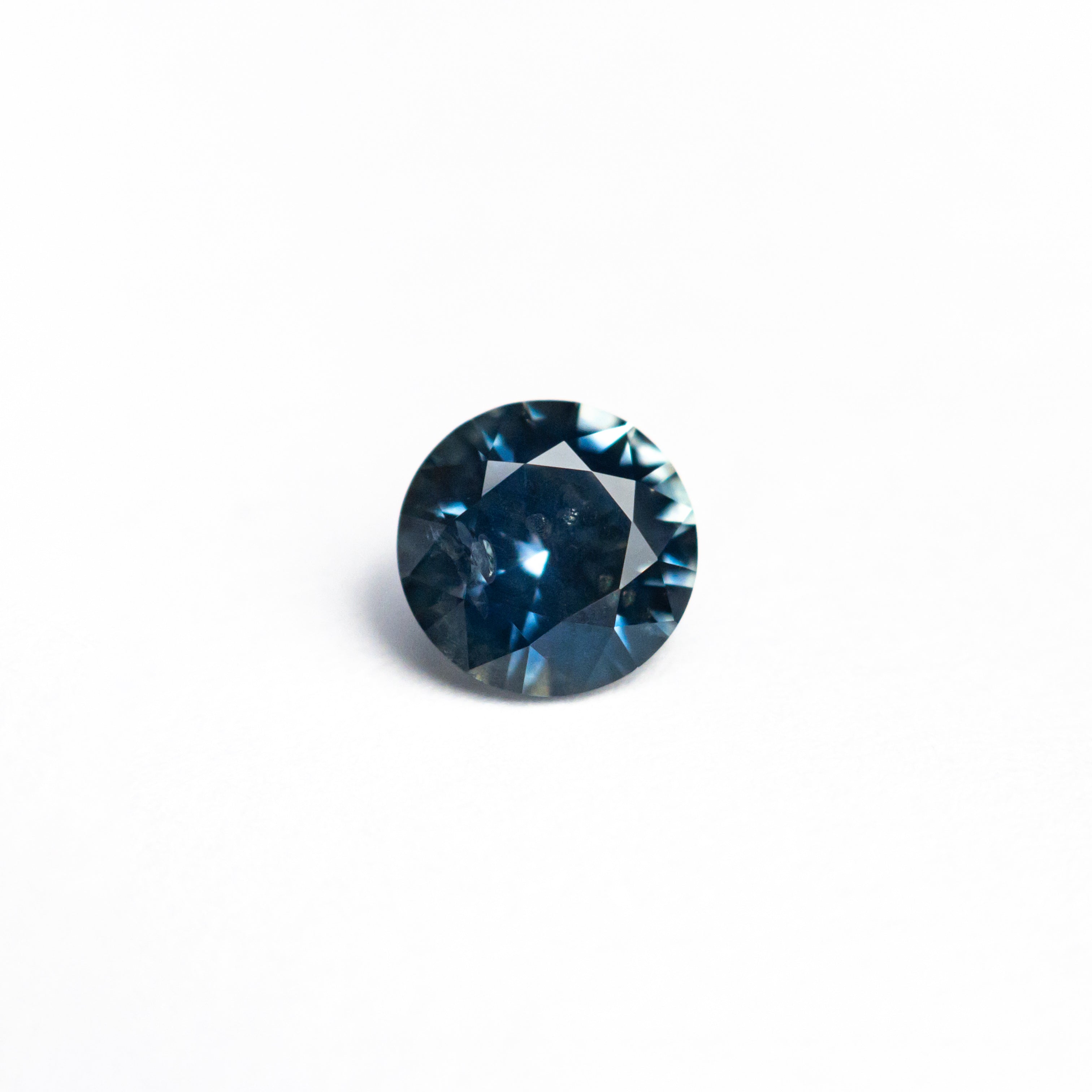 The 0.63ct 5.20x5.18x3.19mm Round Brilliant Sapphire 26556-24 by East London jeweller Rachel Boston | Discover our collections of unique and timeless engagement rings, wedding rings, and modern fine jewellery.