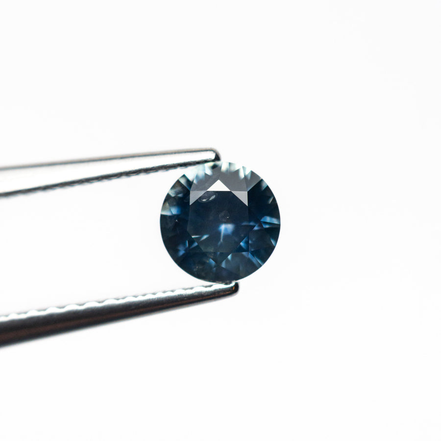 The 0.63ct 5.20x5.18x3.19mm Round Brilliant Sapphire 26556-24 by East London jeweller Rachel Boston | Discover our collections of unique and timeless engagement rings, wedding rings, and modern fine jewellery. - Rachel Boston Jewellery