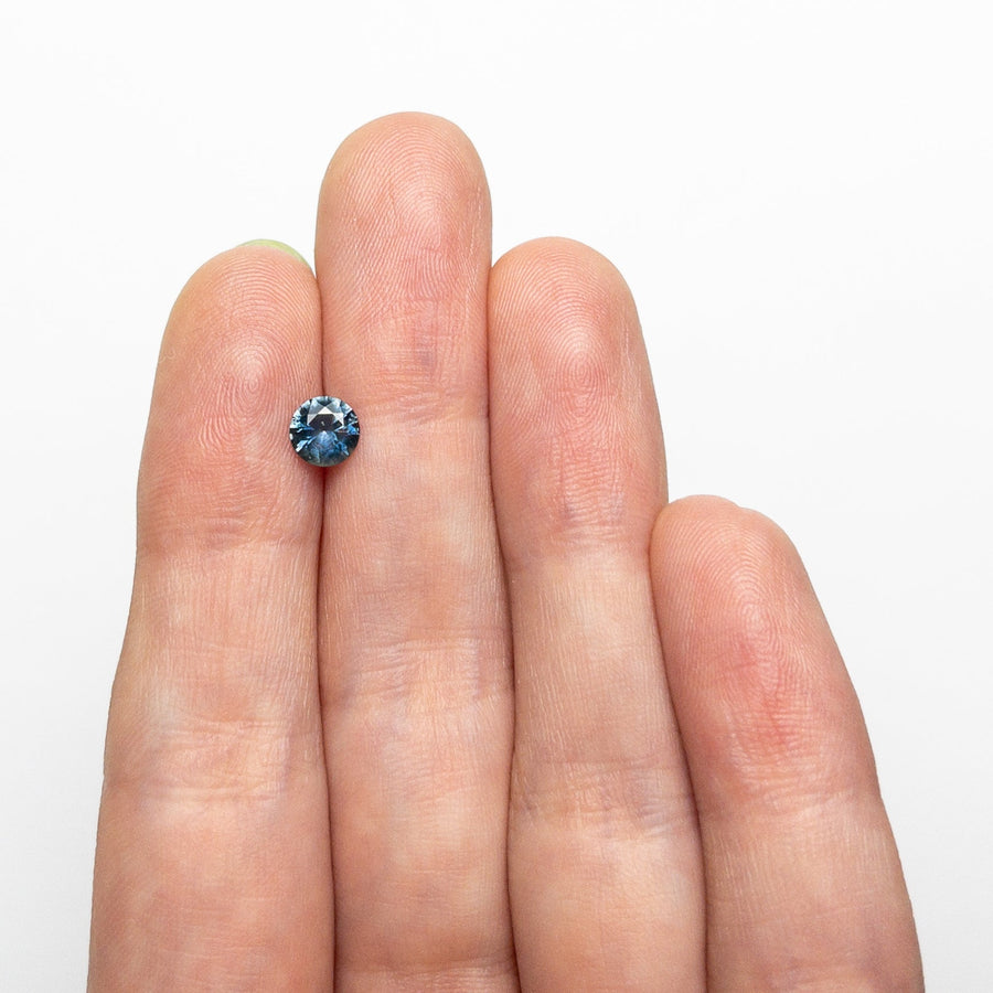 The 0.63ct 5.20x5.18x3.19mm Round Brilliant Sapphire 26556-24 by East London jeweller Rachel Boston | Discover our collections of unique and timeless engagement rings, wedding rings, and modern fine jewellery. - Rachel Boston Jewellery