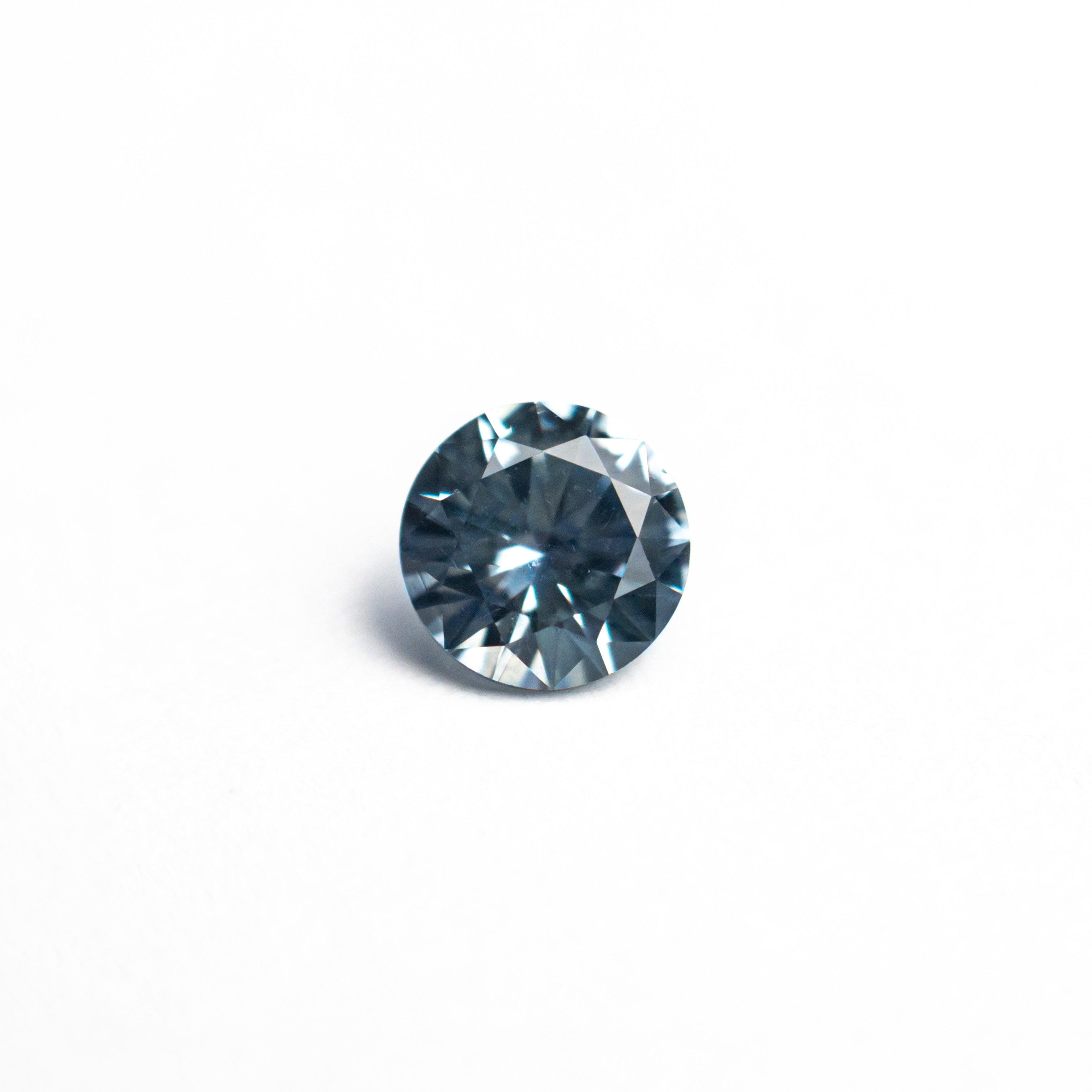 The 0.57ct 4.97x4.94x3.12mm Round Brilliant Sapphire 26556-25 by East London jeweller Rachel Boston | Discover our collections of unique and timeless engagement rings, wedding rings, and modern fine jewellery.