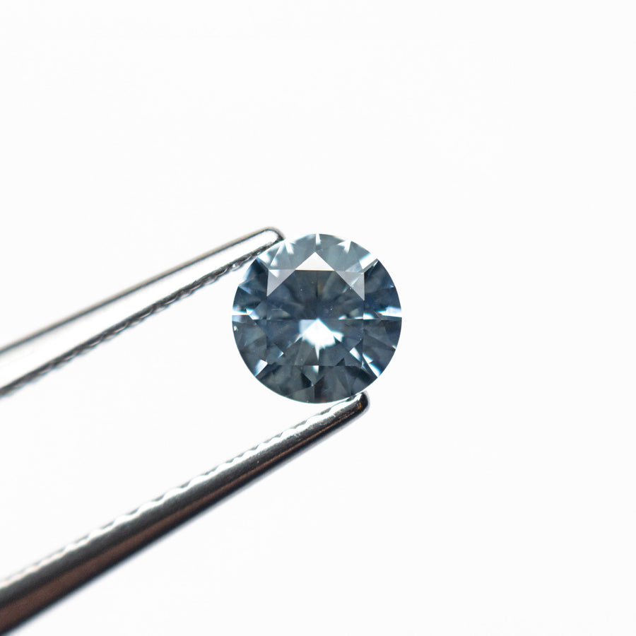 The 0.57ct 4.97x4.94x3.12mm Round Brilliant Sapphire 26556-25 by East London jeweller Rachel Boston | Discover our collections of unique and timeless engagement rings, wedding rings, and modern fine jewellery. - Rachel Boston Jewellery