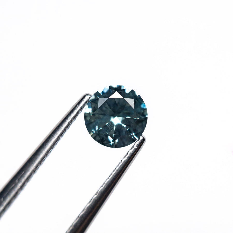 The 0.57ct 5.08x5.04x2.97mm Round Brilliant Sapphire 26556-28 by East London jeweller Rachel Boston | Discover our collections of unique and timeless engagement rings, wedding rings, and modern fine jewellery. - Rachel Boston Jewellery