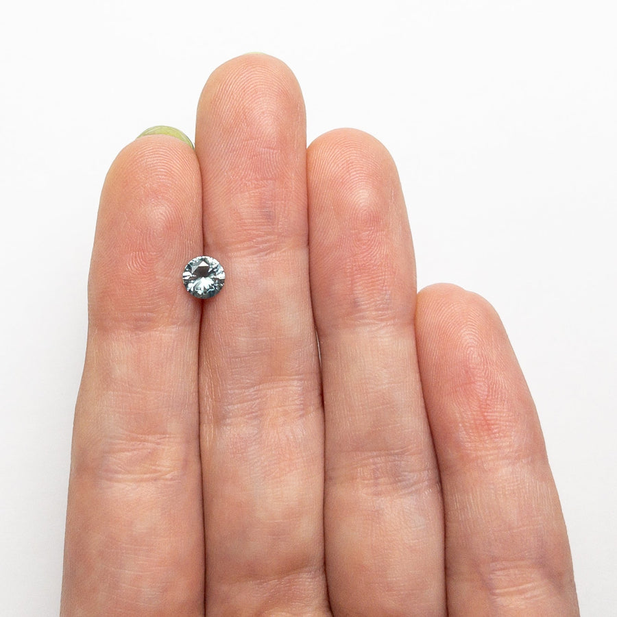 The 0.57ct 5.08x5.04x2.97mm Round Brilliant Sapphire 26556-28 by East London jeweller Rachel Boston | Discover our collections of unique and timeless engagement rings, wedding rings, and modern fine jewellery. - Rachel Boston Jewellery