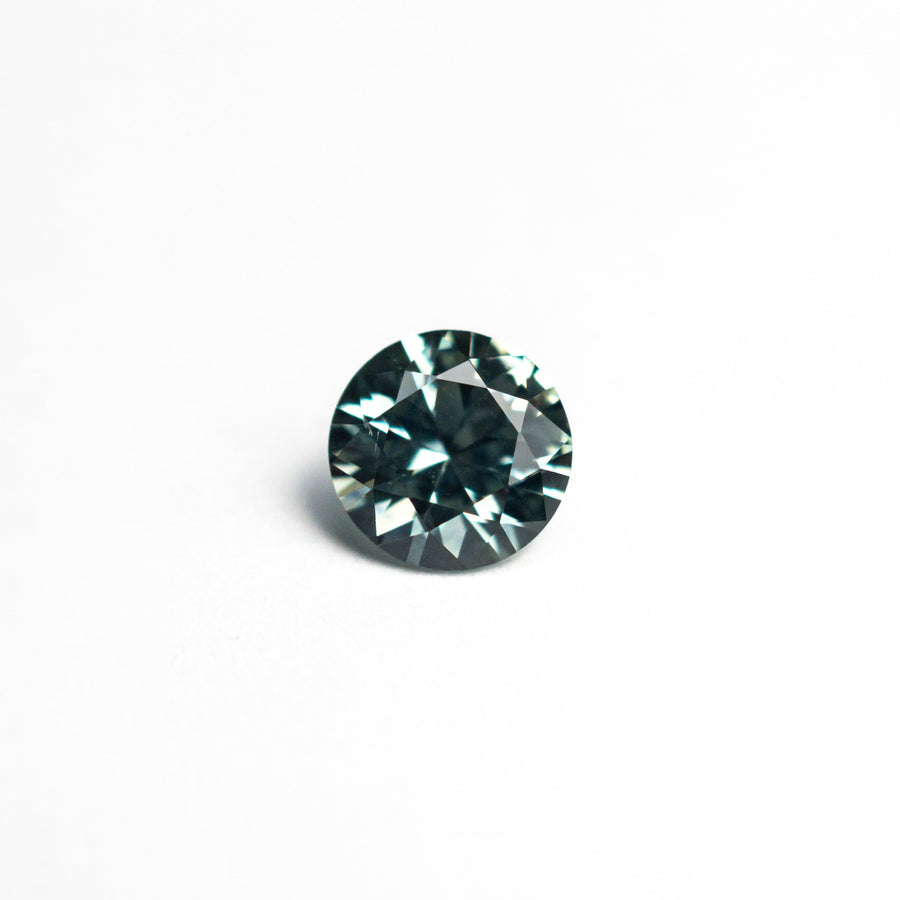 The 0.63ct 5.07x5.06x3.30mm Round Brilliant Sapphire 26556-31 by East London jeweller Rachel Boston | Discover our collections of unique and timeless engagement rings, wedding rings, and modern fine jewellery. - Rachel Boston Jewellery