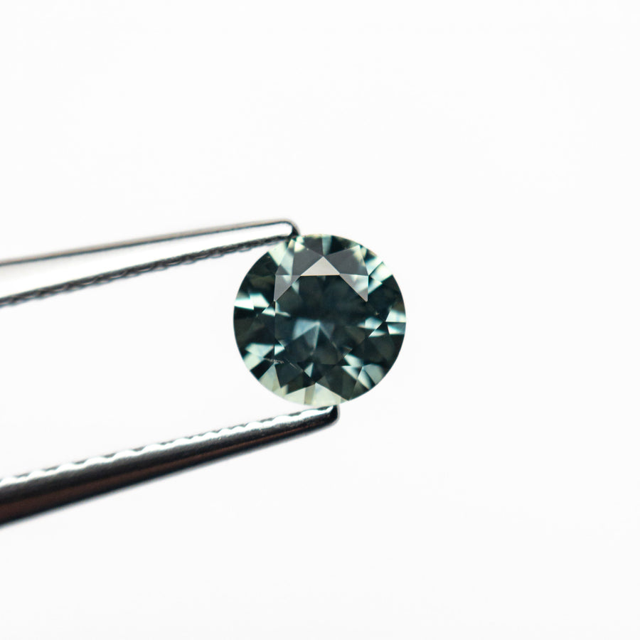 The 0.63ct 5.07x5.06x3.30mm Round Brilliant Sapphire 26556-31 by East London jeweller Rachel Boston | Discover our collections of unique and timeless engagement rings, wedding rings, and modern fine jewellery. - Rachel Boston Jewellery