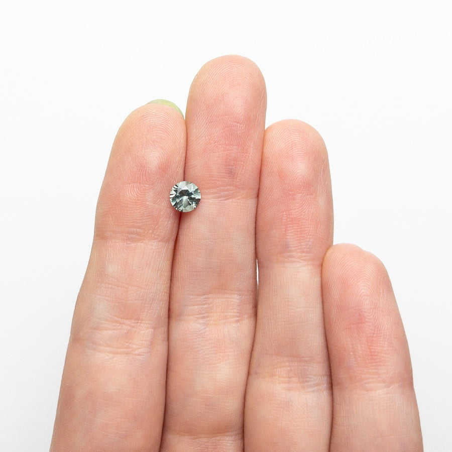 The 0.63ct 5.07x5.06x3.30mm Round Brilliant Sapphire 26556-31 by East London jeweller Rachel Boston | Discover our collections of unique and timeless engagement rings, wedding rings, and modern fine jewellery. - Rachel Boston Jewellery