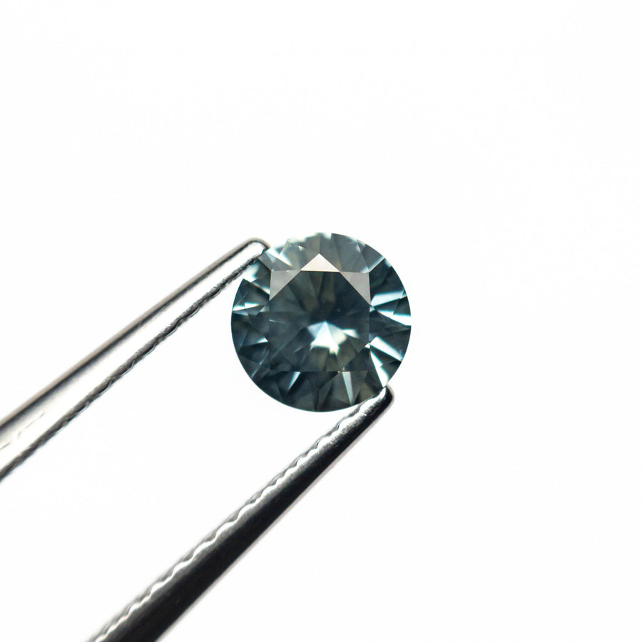 The 0.64ct 5.27x5.20x3.21mm Round Brilliant Sapphire 26556-32 by East London jeweller Rachel Boston | Discover our collections of unique and timeless engagement rings, wedding rings, and modern fine jewellery. - Rachel Boston Jewellery