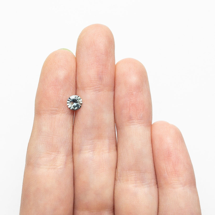The 0.64ct 5.27x5.20x3.21mm Round Brilliant Sapphire 26556-32 by East London jeweller Rachel Boston | Discover our collections of unique and timeless engagement rings, wedding rings, and modern fine jewellery. - Rachel Boston Jewellery