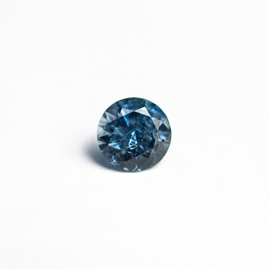 The 0.69ct 5.22x5.17x3.59mm Round Brilliant Sapphire 26556-33 by East London jeweller Rachel Boston | Discover our collections of unique and timeless engagement rings, wedding rings, and modern fine jewellery. - Rachel Boston Jewellery