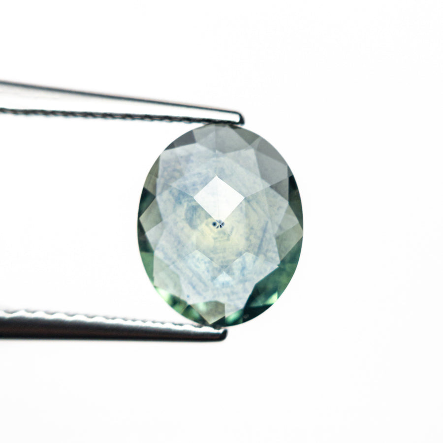 The 1.44ct 8.85x7.23x2.45mm Oval Rosecut Sapphire 26582-16 by East London jeweller Rachel Boston | Discover our collections of unique and timeless engagement rings, wedding rings, and modern fine jewellery. - Rachel Boston Jewellery