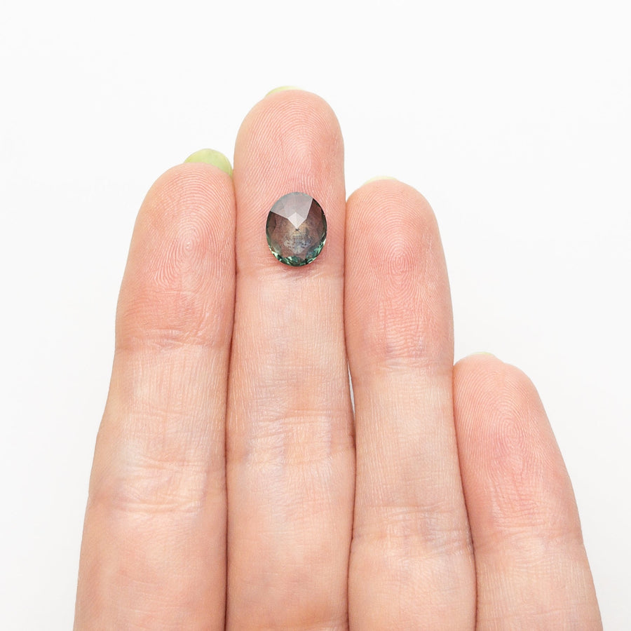 The 1.44ct 8.85x7.23x2.45mm Oval Rosecut Sapphire 26582-16 by East London jeweller Rachel Boston | Discover our collections of unique and timeless engagement rings, wedding rings, and modern fine jewellery. - Rachel Boston Jewellery
