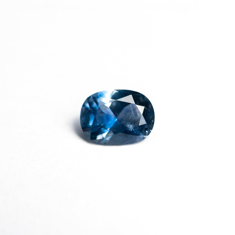 The 0.60ct 5.89x4.41x2.89mm Cushion Brilliant Sapphire 26617-02 by East London jeweller Rachel Boston | Discover our collections of unique and timeless engagement rings, wedding rings, and modern fine jewellery. - Rachel Boston Jewellery