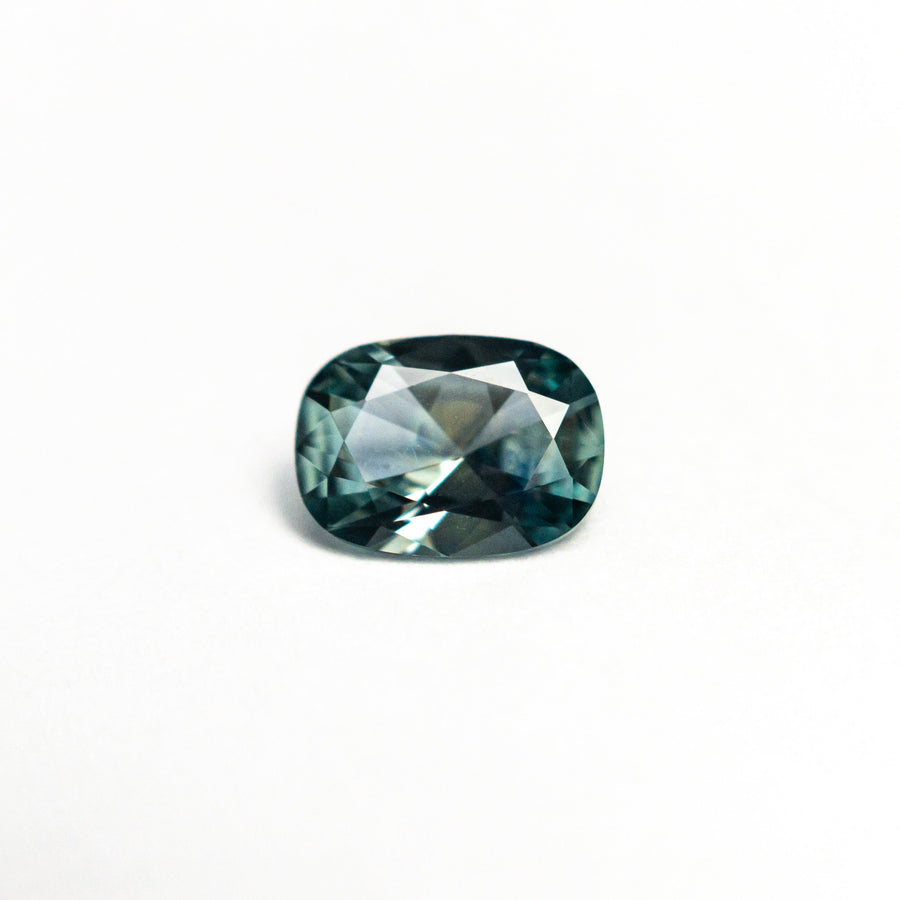 The 0.71ct 6.45x4.75x2.81mm Cushion Brilliant Sapphire 26618-01 by East London jeweller Rachel Boston | Discover our collections of unique and timeless engagement rings, wedding rings, and modern fine jewellery. - Rachel Boston Jewellery