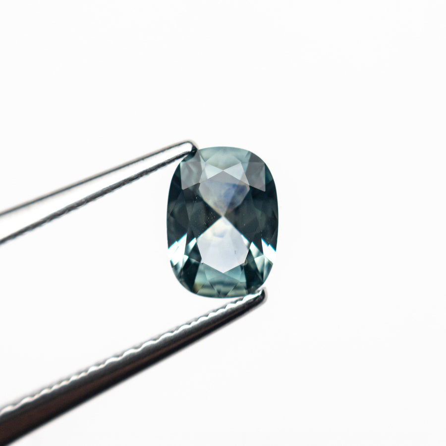 The 0.71ct 6.45x4.75x2.81mm Cushion Brilliant Sapphire 26618-01 by East London jeweller Rachel Boston | Discover our collections of unique and timeless engagement rings, wedding rings, and modern fine jewellery. - Rachel Boston Jewellery