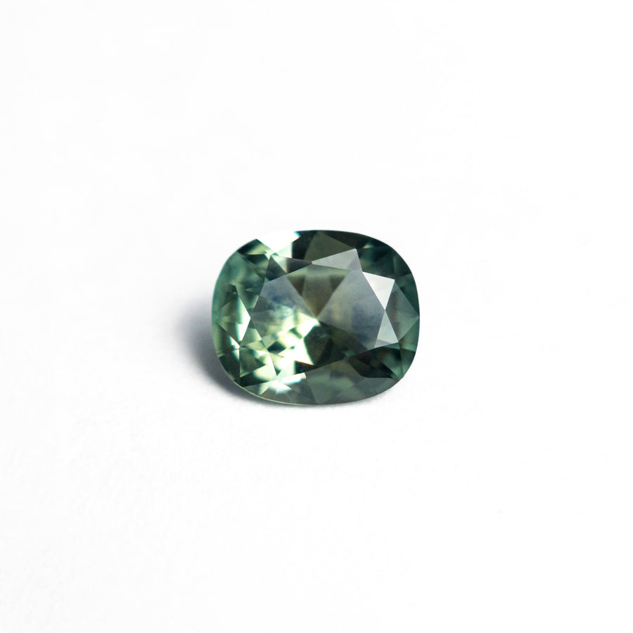 The 0.80ct 6.20x5.22x3.01mm Cushion Brilliant Sapphire 26618-03 by East London jeweller Rachel Boston | Discover our collections of unique and timeless engagement rings, wedding rings, and modern fine jewellery. - Rachel Boston Jewellery