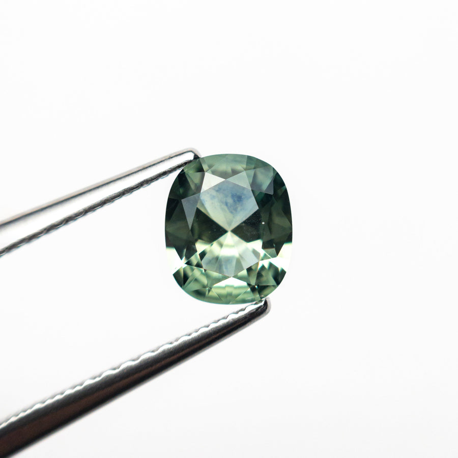 The 0.80ct 6.20x5.22x3.01mm Cushion Brilliant Sapphire 26618-03 by East London jeweller Rachel Boston | Discover our collections of unique and timeless engagement rings, wedding rings, and modern fine jewellery. - Rachel Boston Jewellery