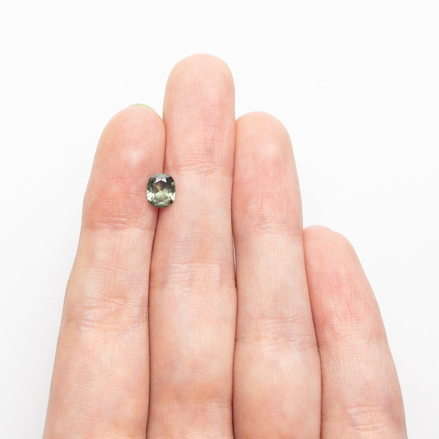The 0.80ct 6.20x5.22x3.01mm Cushion Brilliant Sapphire 26618-03 by East London jeweller Rachel Boston | Discover our collections of unique and timeless engagement rings, wedding rings, and modern fine jewellery. - Rachel Boston Jewellery
