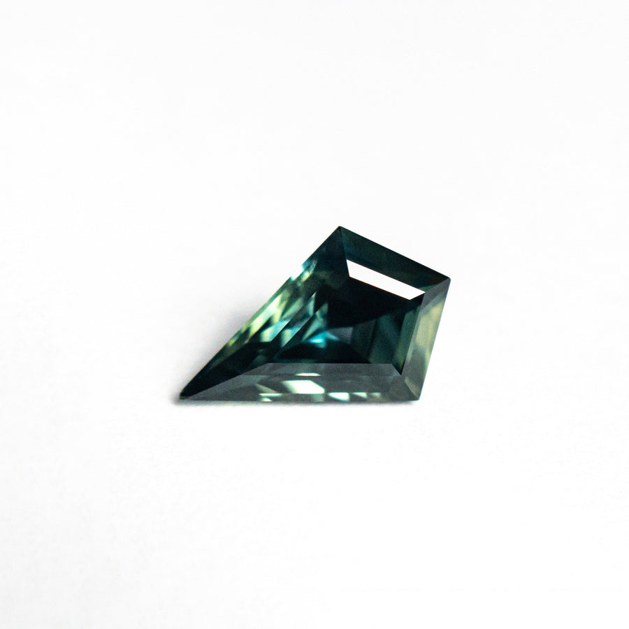 The 0.90ct 8.87x5.80x3.64mm Kite Step Cut Sapphire 26633-04 by East London jeweller Rachel Boston | Discover our collections of unique and timeless engagement rings, wedding rings, and modern fine jewellery. - Rachel Boston Jewellery