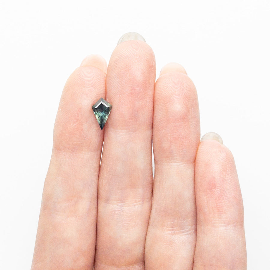 The 0.90ct 8.87x5.80x3.64mm Kite Step Cut Sapphire 26633-04 by East London jeweller Rachel Boston | Discover our collections of unique and timeless engagement rings, wedding rings, and modern fine jewellery. - Rachel Boston Jewellery