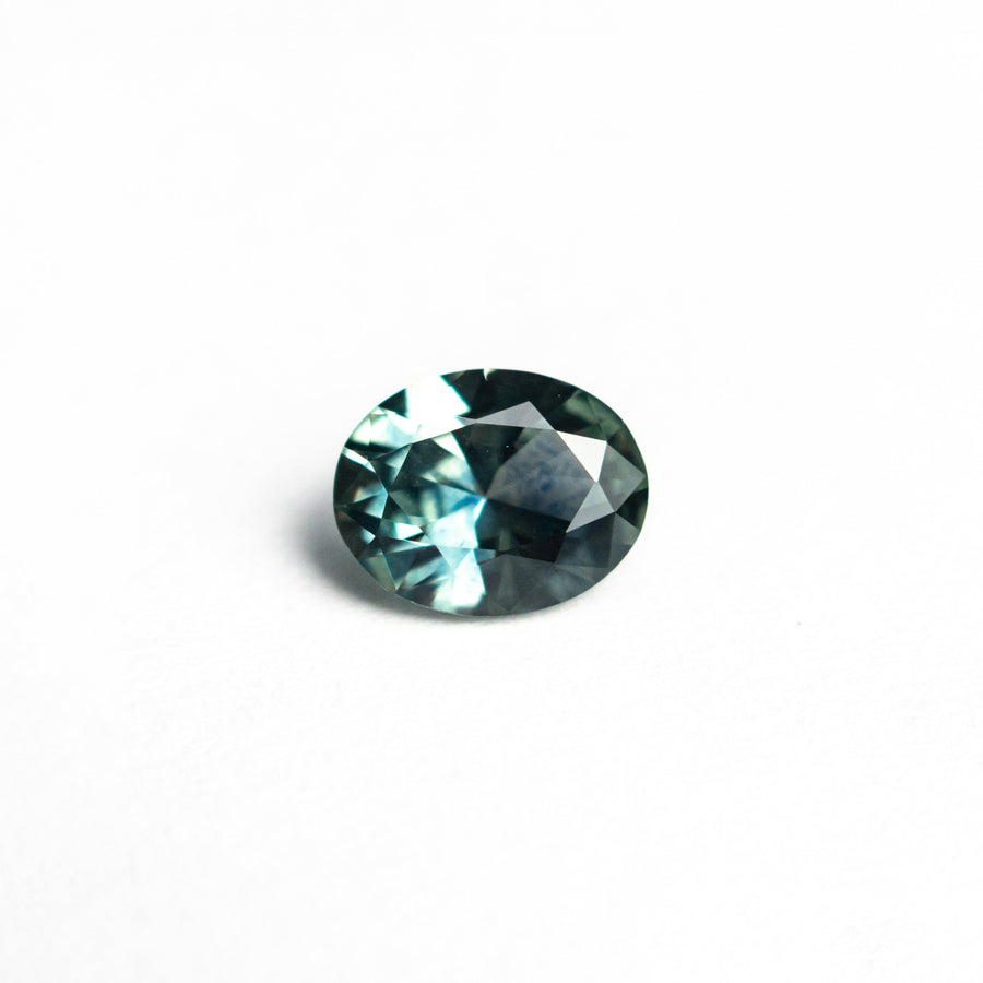 The 0.66ct 6.08x4.80x2.94mm Oval Brilliant Sapphire 26668-04 by East London jeweller Rachel Boston | Discover our collections of unique and timeless engagement rings, wedding rings, and modern fine jewellery. - Rachel Boston Jewellery
