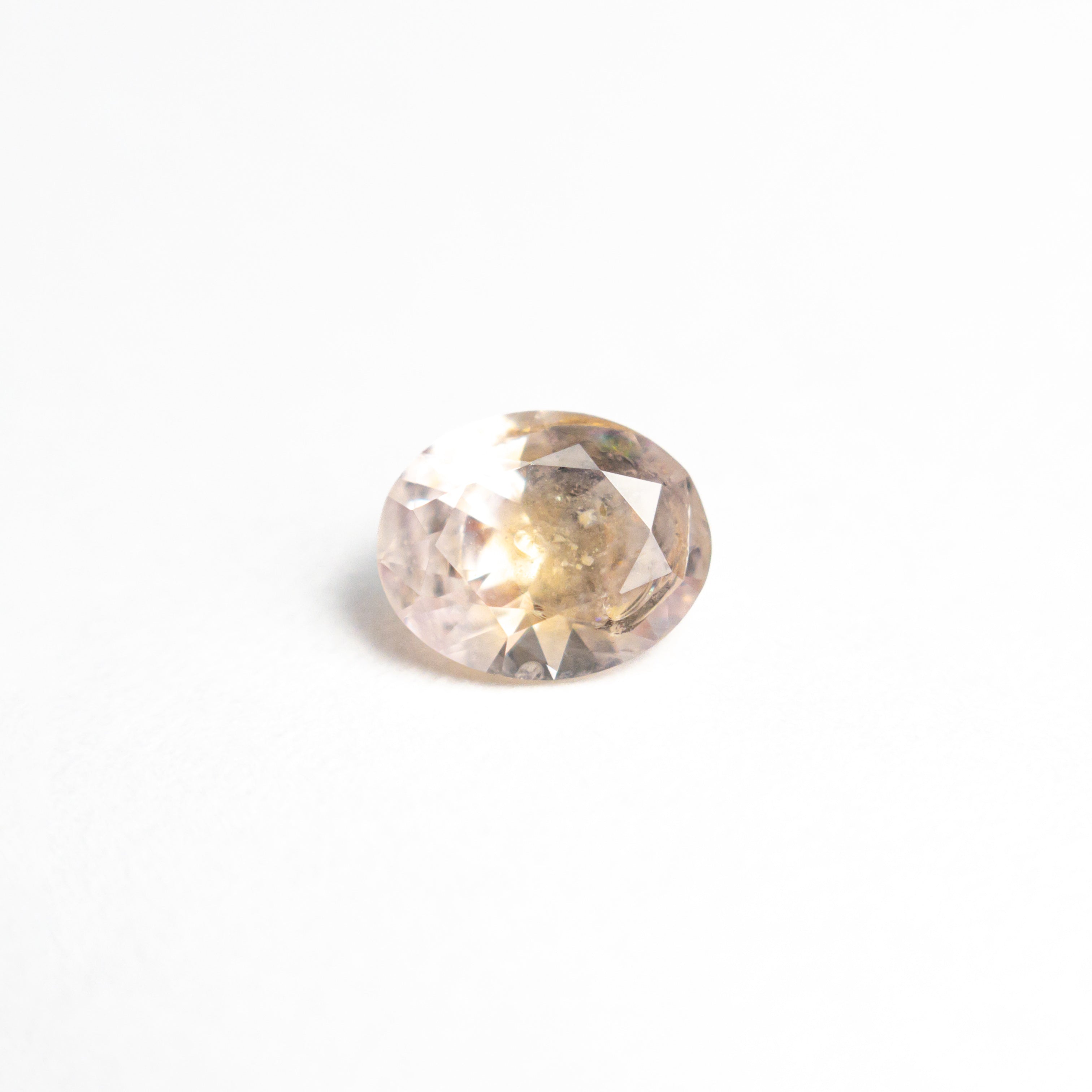 The 0.60ct 5.78x4.71x2.98mm Oval Brilliant Sapphire 26668-09 by East London jeweller Rachel Boston | Discover our collections of unique and timeless engagement rings, wedding rings, and modern fine jewellery.