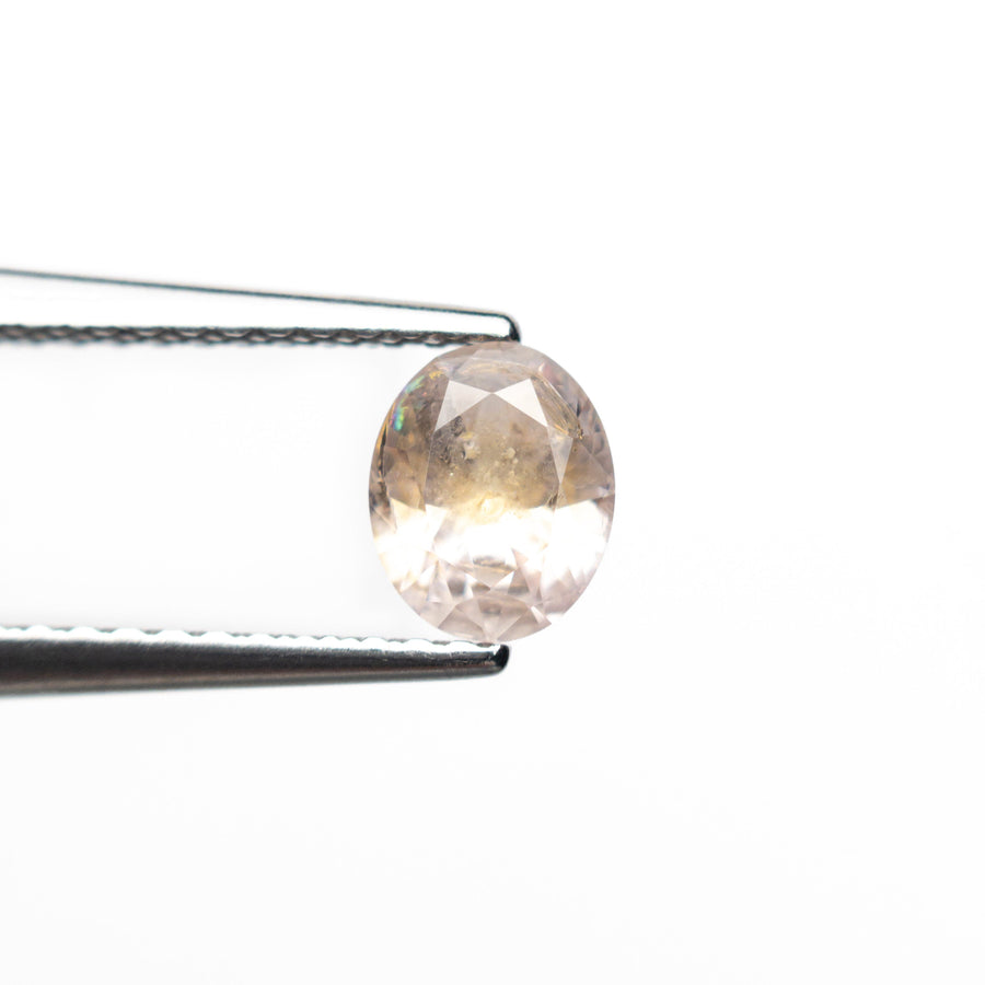 The 0.60ct 5.78x4.71x2.98mm Oval Brilliant Sapphire 26668-09 by East London jeweller Rachel Boston | Discover our collections of unique and timeless engagement rings, wedding rings, and modern fine jewellery. - Rachel Boston Jewellery