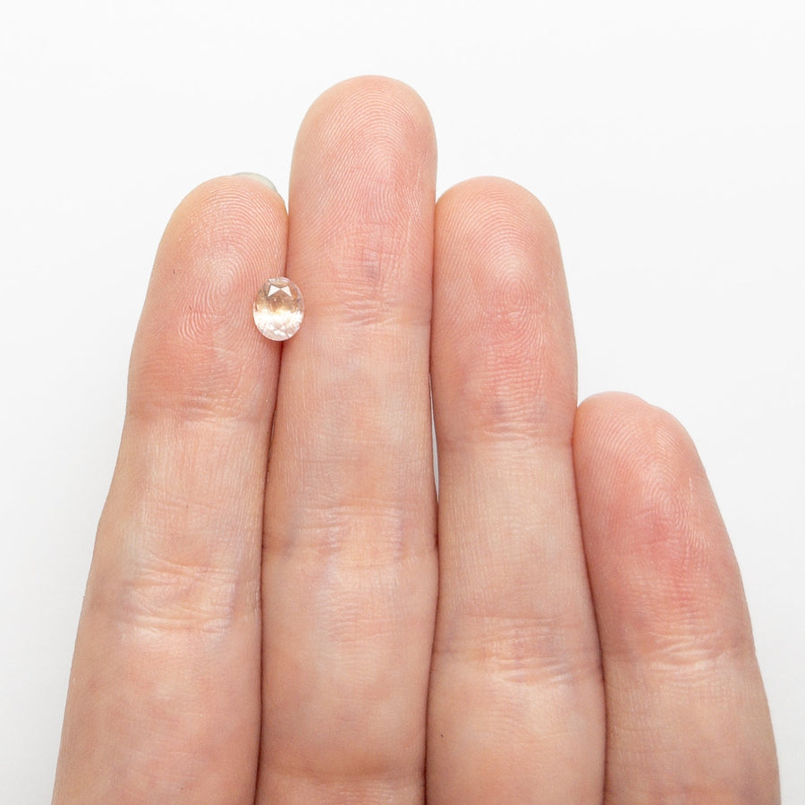 The 0.60ct 5.78x4.71x2.98mm Oval Brilliant Sapphire 26668-09 by East London jeweller Rachel Boston | Discover our collections of unique and timeless engagement rings, wedding rings, and modern fine jewellery. - Rachel Boston Jewellery