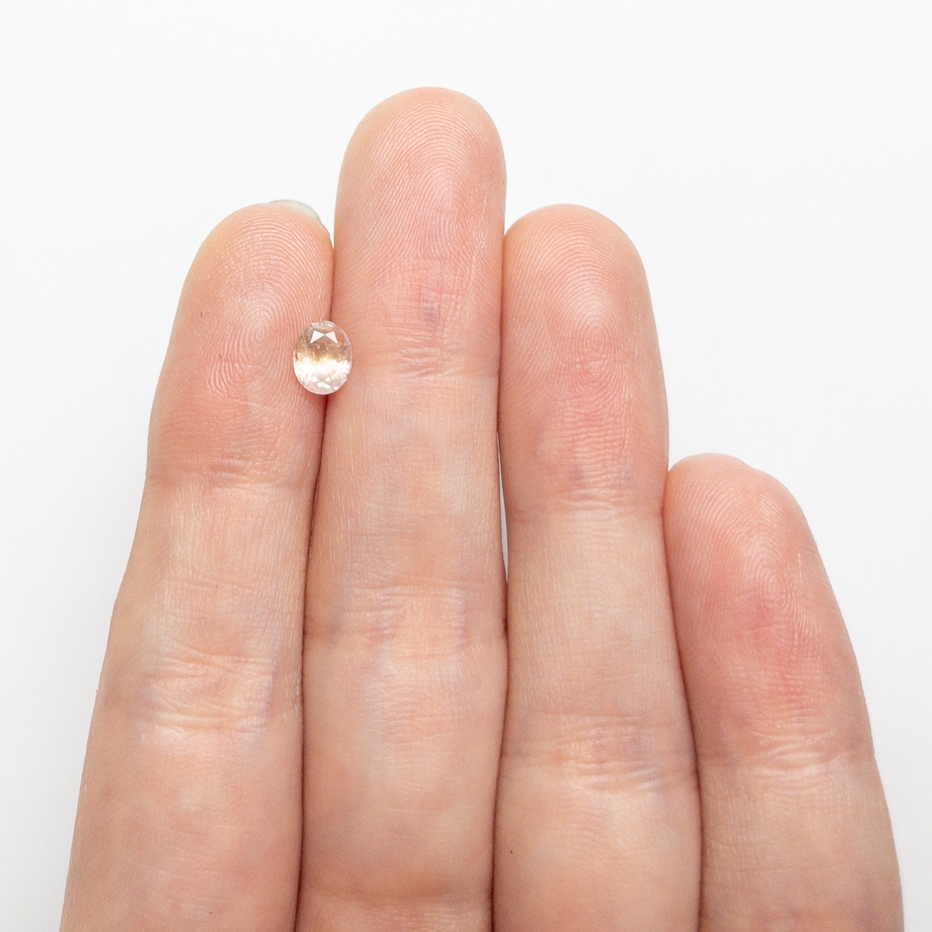 The 0.60ct 5.78x4.71x2.98mm Oval Brilliant Sapphire 26668-09 by East London jeweller Rachel Boston | Discover our collections of unique and timeless engagement rings, wedding rings, and modern fine jewellery.