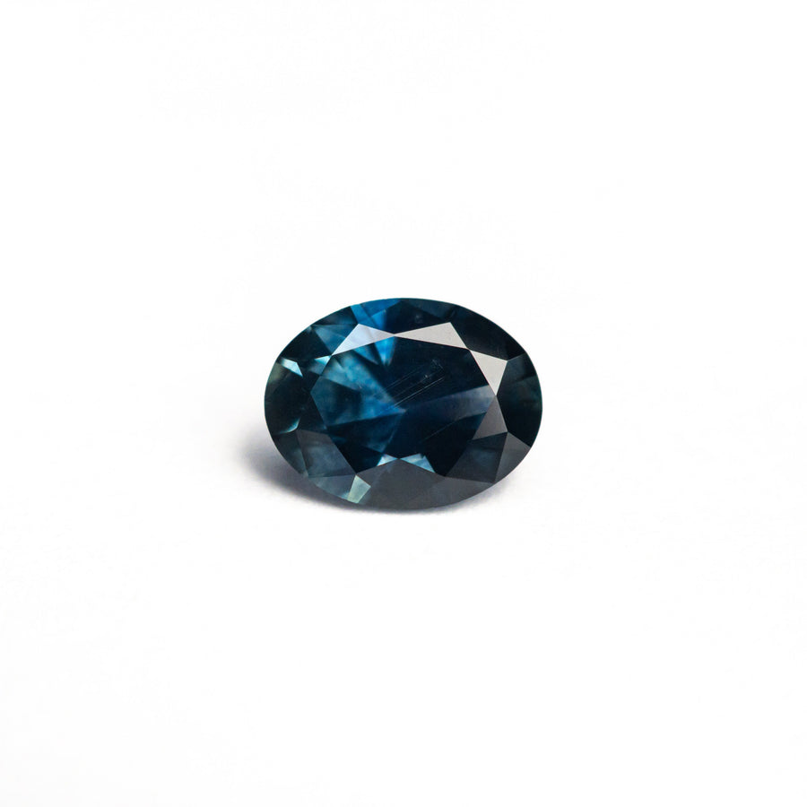 The 0.77ct 6.46x4.99x3.26mm Oval Brilliant Sapphire 26668-12 by East London jeweller Rachel Boston | Discover our collections of unique and timeless engagement rings, wedding rings, and modern fine jewellery. - Rachel Boston Jewellery