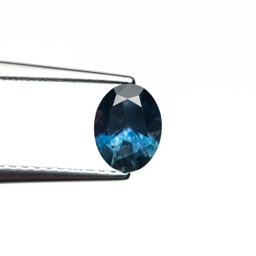 The 0.77ct 6.46x4.99x3.26mm Oval Brilliant Sapphire 26668-12 by East London jeweller Rachel Boston | Discover our collections of unique and timeless engagement rings, wedding rings, and modern fine jewellery. - Rachel Boston Jewellery