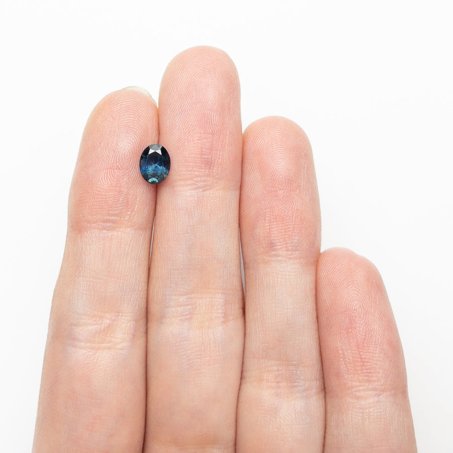 The 0.77ct 6.46x4.99x3.26mm Oval Brilliant Sapphire 26668-12 by East London jeweller Rachel Boston | Discover our collections of unique and timeless engagement rings, wedding rings, and modern fine jewellery. - Rachel Boston Jewellery
