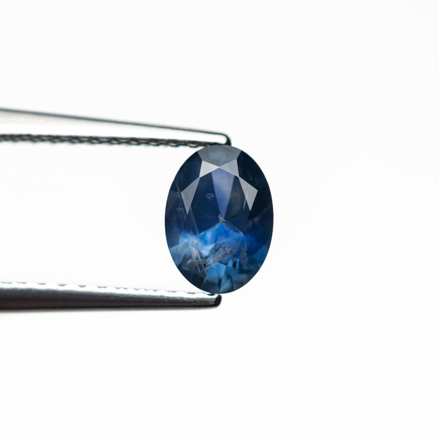 The 0.73ct 6.41x4.65x3.22mm Oval Brilliant Sapphire 26668-13 by East London jeweller Rachel Boston | Discover our collections of unique and timeless engagement rings, wedding rings, and modern fine jewellery. - Rachel Boston Jewellery