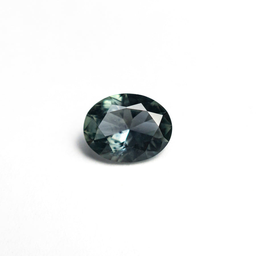 The 0.80ct 6.53x5.11x2.99mm Oval Brilliant Sapphire 26668-23 by East London jeweller Rachel Boston | Discover our collections of unique and timeless engagement rings, wedding rings, and modern fine jewellery. - Rachel Boston Jewellery