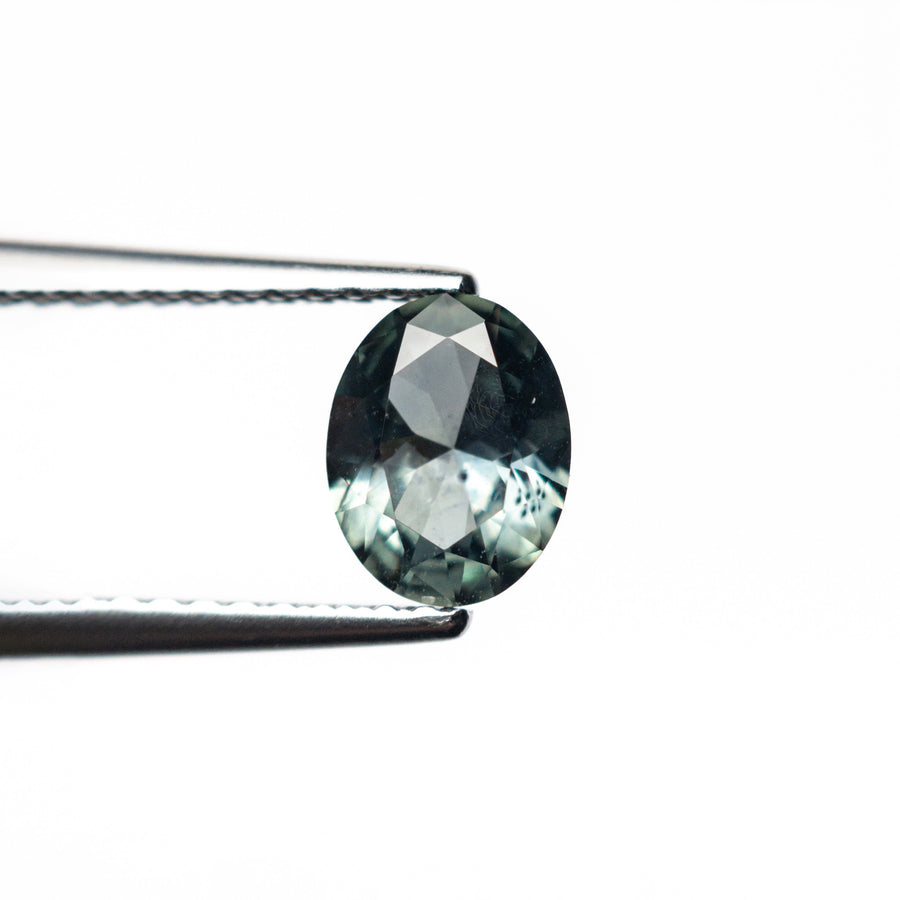 The 0.80ct 6.53x5.11x2.99mm Oval Brilliant Sapphire 26668-23 by East London jeweller Rachel Boston | Discover our collections of unique and timeless engagement rings, wedding rings, and modern fine jewellery. - Rachel Boston Jewellery