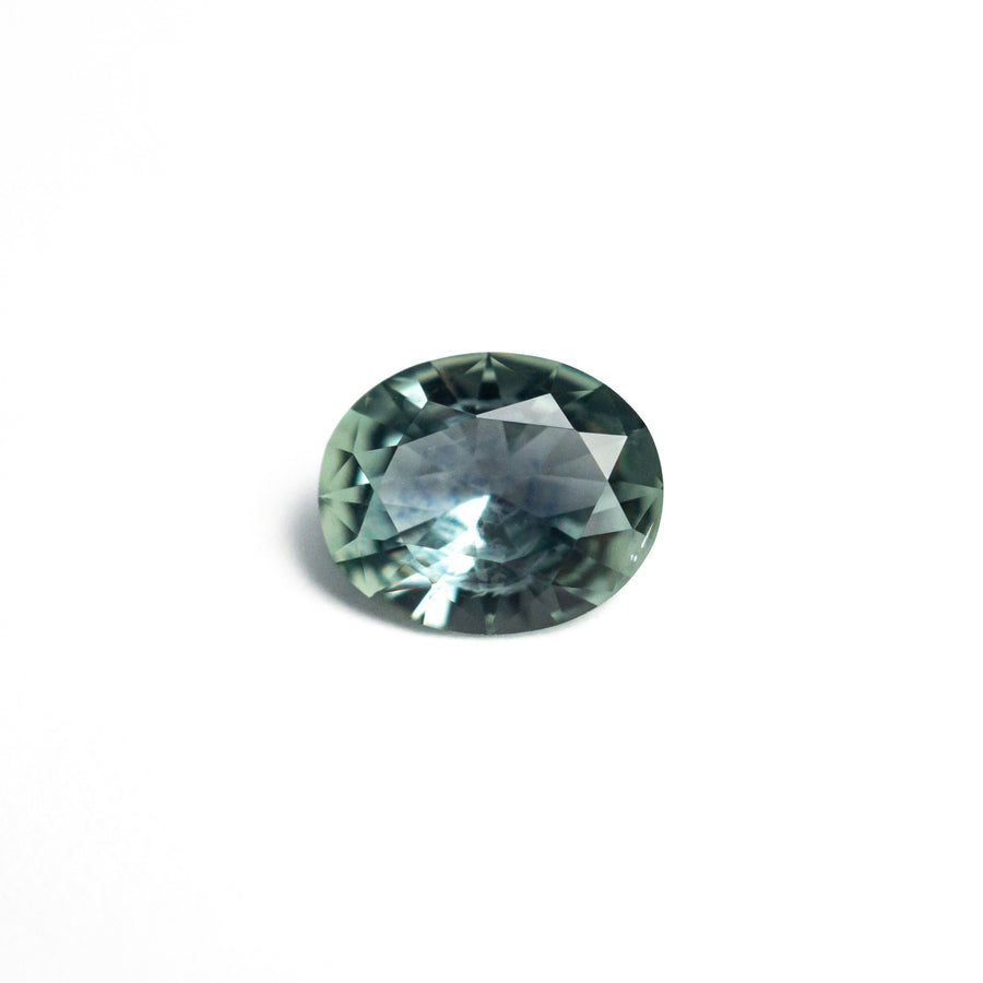 The 0.81ct 6.63x5.51x2.97mm Oval Brilliant Sapphire 26668-25 by East London jeweller Rachel Boston | Discover our collections of unique and timeless engagement rings, wedding rings, and modern fine jewellery. - Rachel Boston Jewellery