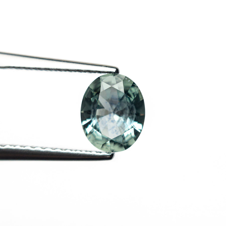 The 0.81ct 6.63x5.51x2.97mm Oval Brilliant Sapphire 26668-25 by East London jeweller Rachel Boston | Discover our collections of unique and timeless engagement rings, wedding rings, and modern fine jewellery. - Rachel Boston Jewellery