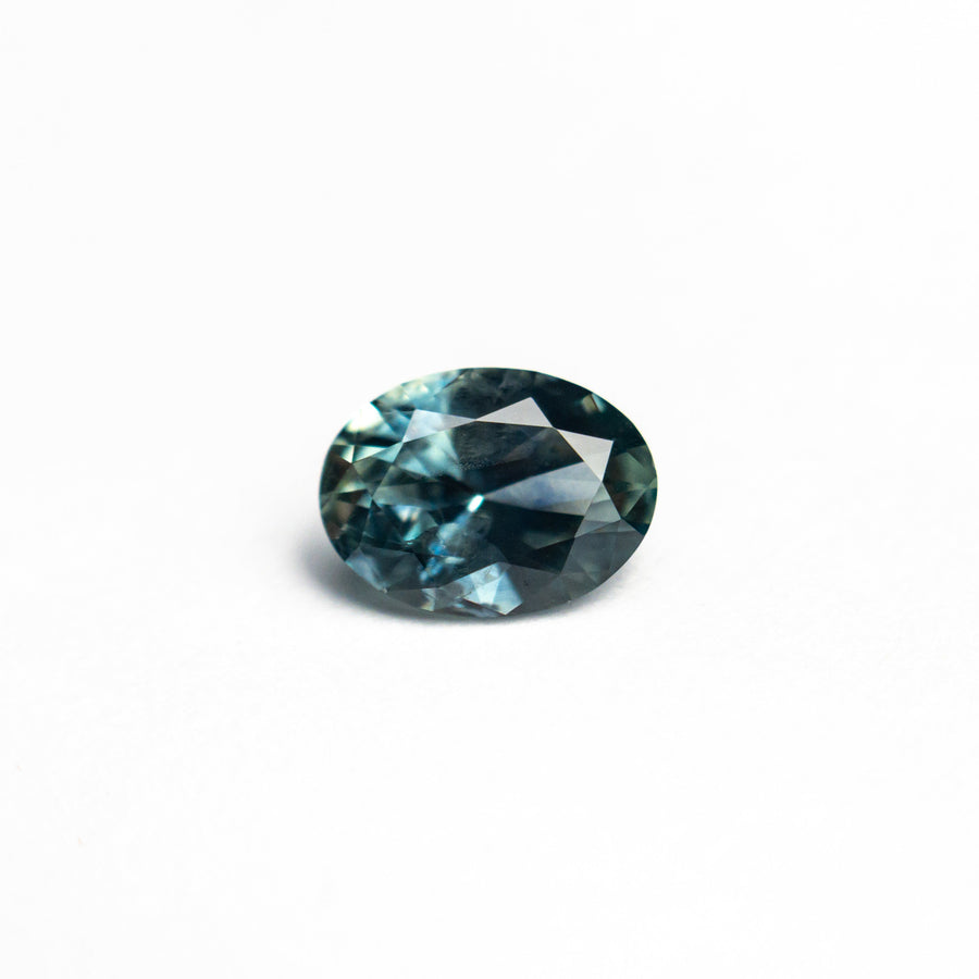 The 0.72ct 6.45x4.78x3.10mm Oval Brilliant Sapphire 26668-26 by East London jeweller Rachel Boston | Discover our collections of unique and timeless engagement rings, wedding rings, and modern fine jewellery. - Rachel Boston Jewellery
