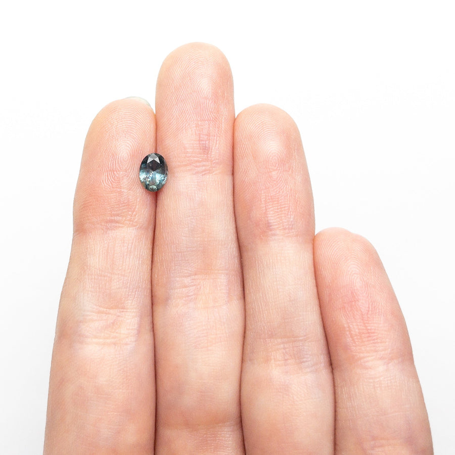 The 0.72ct 6.45x4.78x3.10mm Oval Brilliant Sapphire 26668-26 by East London jeweller Rachel Boston | Discover our collections of unique and timeless engagement rings, wedding rings, and modern fine jewellery. - Rachel Boston Jewellery