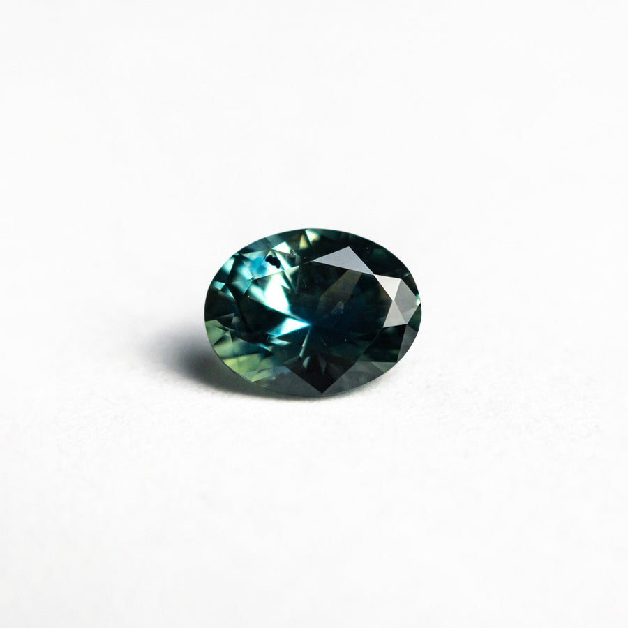 The 0.86ct 6.46x5.10x3.55mm Oval Brilliant Sapphire 26668-27 by East London jeweller Rachel Boston | Discover our collections of unique and timeless engagement rings, wedding rings, and modern fine jewellery. - Rachel Boston Jewellery