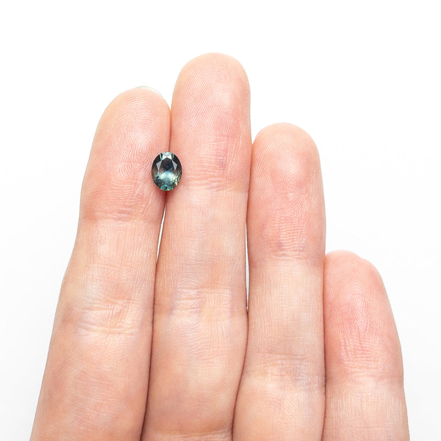 The 0.86ct 6.46x5.10x3.55mm Oval Brilliant Sapphire 26668-27 by East London jeweller Rachel Boston | Discover our collections of unique and timeless engagement rings, wedding rings, and modern fine jewellery. - Rachel Boston Jewellery
