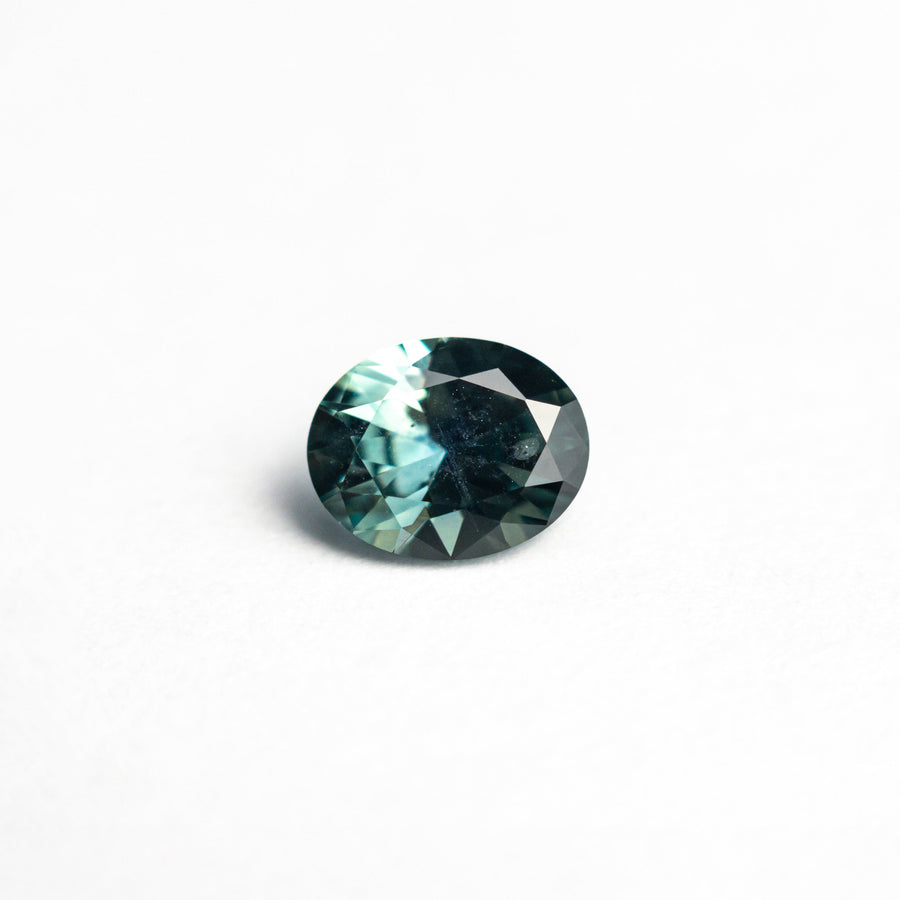 The 0.68ct 5.88x4.74x3.12mm Oval Brilliant Sapphire 26668-28 by East London jeweller Rachel Boston | Discover our collections of unique and timeless engagement rings, wedding rings, and modern fine jewellery. - Rachel Boston Jewellery