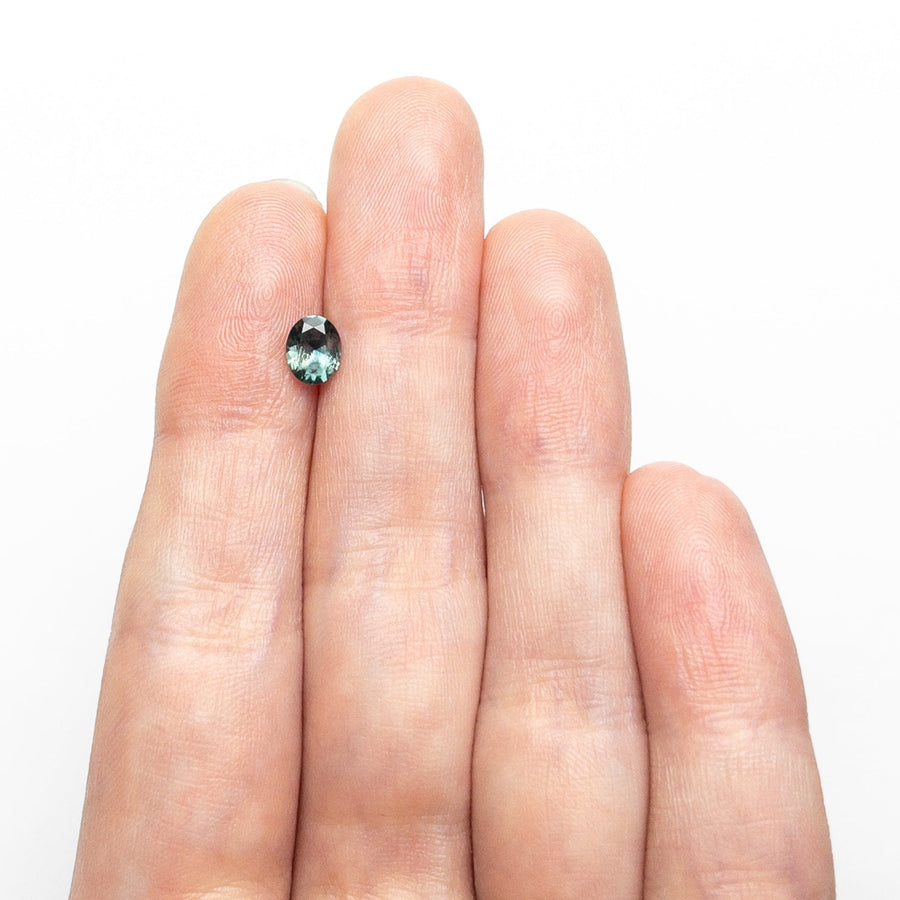 The 0.68ct 5.88x4.74x3.12mm Oval Brilliant Sapphire 26668-28 by East London jeweller Rachel Boston | Discover our collections of unique and timeless engagement rings, wedding rings, and modern fine jewellery. - Rachel Boston Jewellery