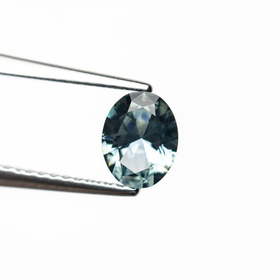 The 0.78ct 6.49x5.15x3.05mm Oval Brilliant Sapphire 26668-30 by East London jeweller Rachel Boston | Discover our collections of unique and timeless engagement rings, wedding rings, and modern fine jewellery. - Rachel Boston Jewellery