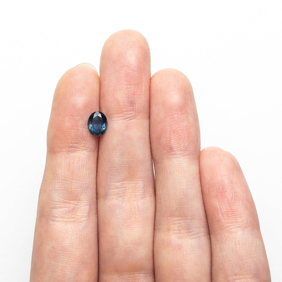 The 0.72ct 6.57x5.25x2.72mm Oval Brilliant Sapphire 26668-31 by East London jeweller Rachel Boston | Discover our collections of unique and timeless engagement rings, wedding rings, and modern fine jewellery. - Rachel Boston Jewellery