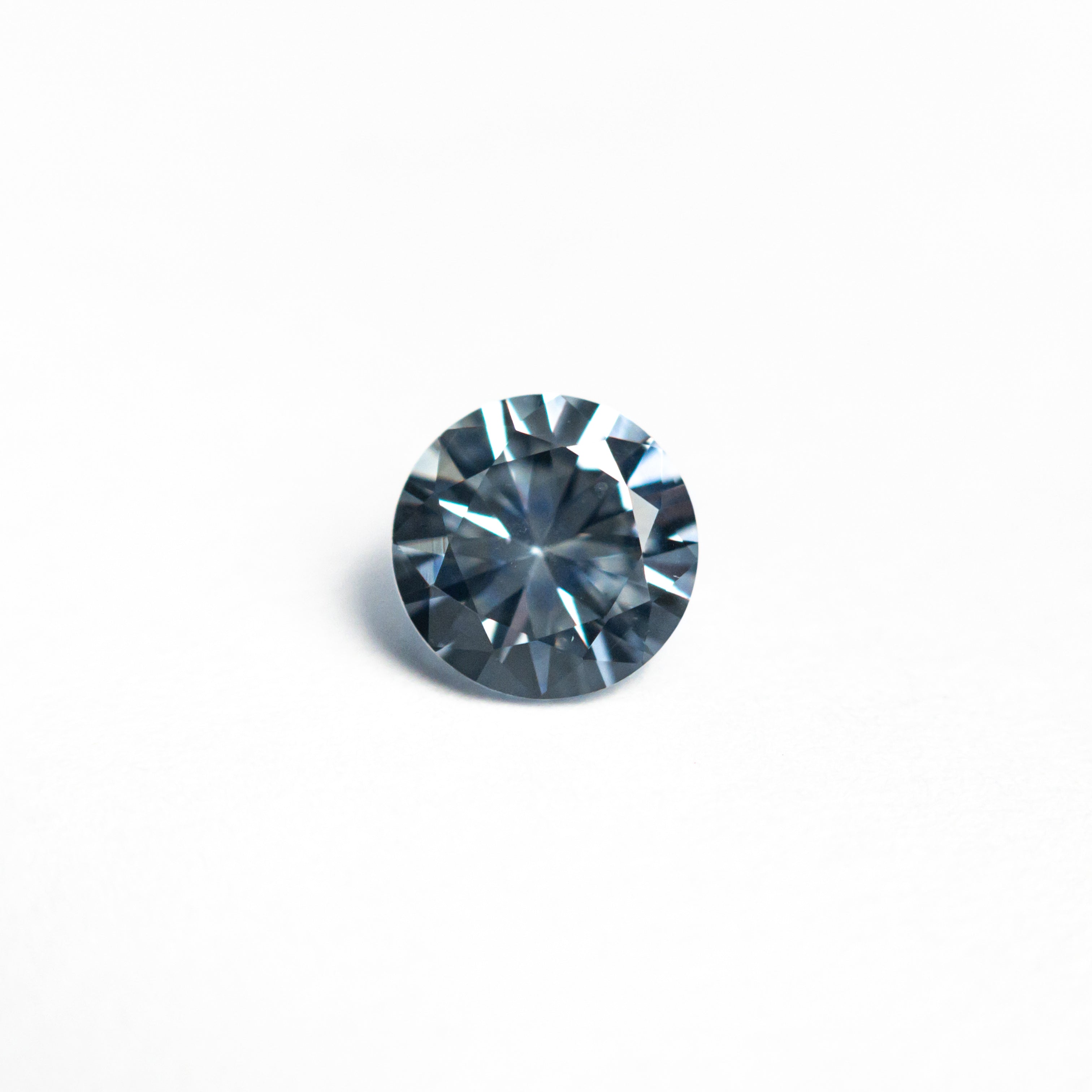 The 0.69ct 5.33x5.31x3.40mm Round Brilliant Sapphire 26766-12 by East London jeweller Rachel Boston | Discover our collections of unique and timeless engagement rings, wedding rings, and modern fine jewellery.